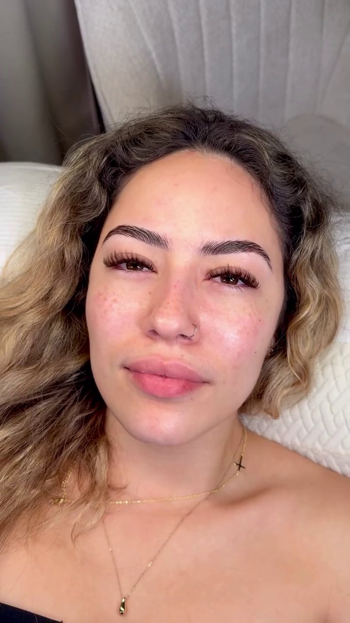 Soft, natural lash set on a client with blonde waves