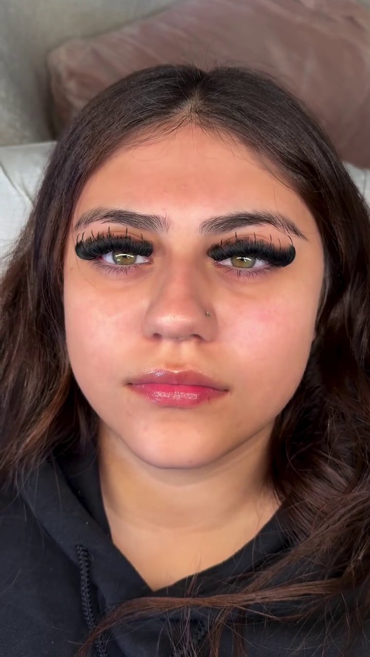 Dense, dark dramatic lash set on green eyes